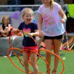 Young girl and teen enjoying their school holiday activity with roundabout circus on the central coast of nsw